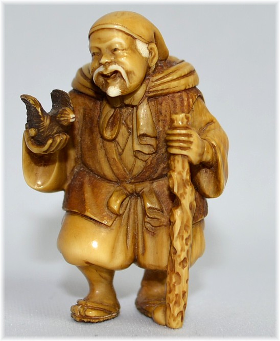 старинная нэцкэ из слоновой кости Старик с птичкой, 1830-е гг.